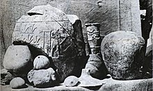 The Narmer macehead (right) at time of discovery, Hierakonpolis Hierakonpolis objects at time of discovery.jpg