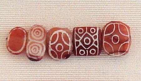 Indus carnelian beads with white design imported to Susa in 2600-1700 BCE LOUVRE Sb 13099.jpg