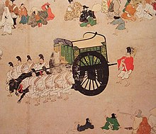 dessin d'un chariot tracté par un bovin noir encadré de huit hommes marchant au pas.