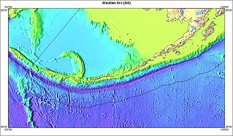 Image showing the Aleutian Island Arc, along with the trench. The trench is denoted by the dark blue line to the south running parallel with the island arc. The area between the trench and the ridge delineates the blocks of crust that cause much of the seismic activity in the region. Island arc of Aleutian trench.jpg