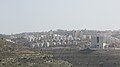 al-Rayhan suburb of Ramallah from the west. The big building on the right is Istishari Arab Hospital. On the left, behind the amusement park is the Arab American University.