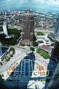 ☎∈ View to the northwest from the Petronas Towers skybridge, including the shadow of Tower 1 and the skybridge, and the Public Bank building.