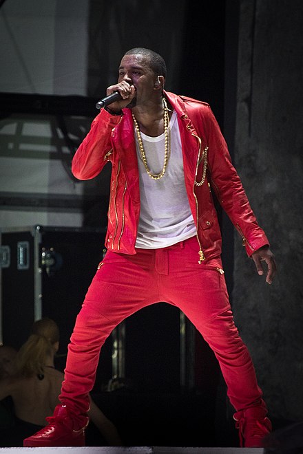 Rapper Kanye West in 2011 wearing hip hop fashion. Hip hop fashion is popular among African Americans. Kanye West is an African American fashion designer for Adidas Yeezy.