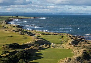 Looking down the 2nd hole at Kingsbarns Golf Links, with The North Sea to the right. Kingsbarns Golf Links 2nd hole and coastline.jpg