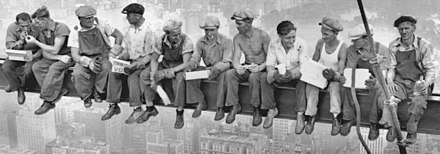 Ironworkers wearing newsboy caps in the famous Lunch atop a Skyscraper picture, 1932 Lunch atop a Skyscraper - Charles Clyde Ebbets (cropped).jpg