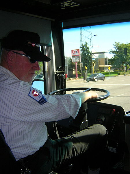 Bus and driver on University Avenue in Minneapolis, Minnesota, near Saint Paul