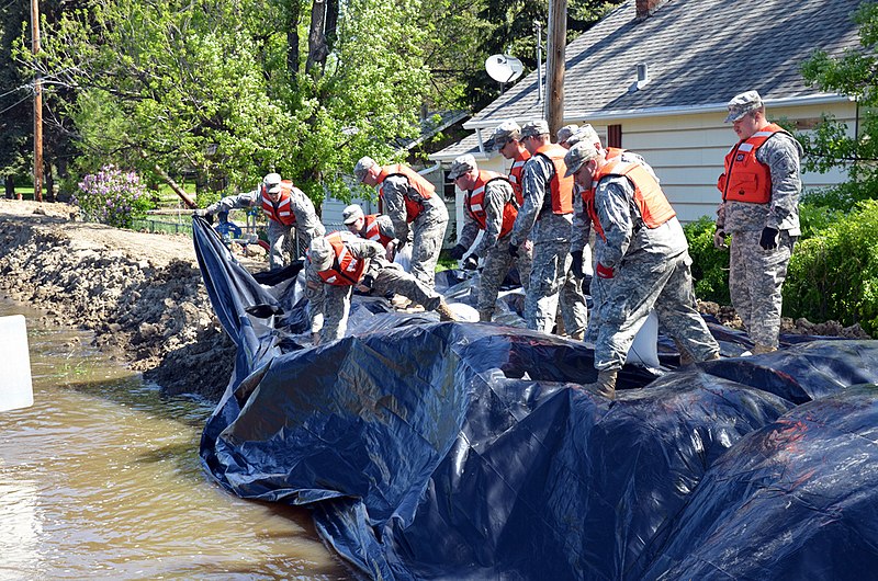 File:North Dakota National Guard soldiers place poly over temporary emergency levees.jpg