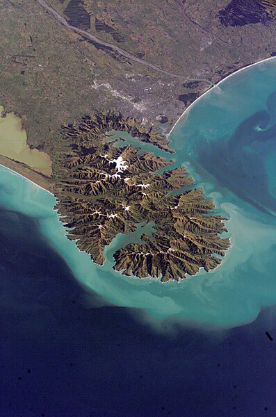 Lyttelton Harbour (right / northwest) and Akaroa Harbour (left / south) in the Banks Peninsula Volcano, viewed in 2006 from the International Space St