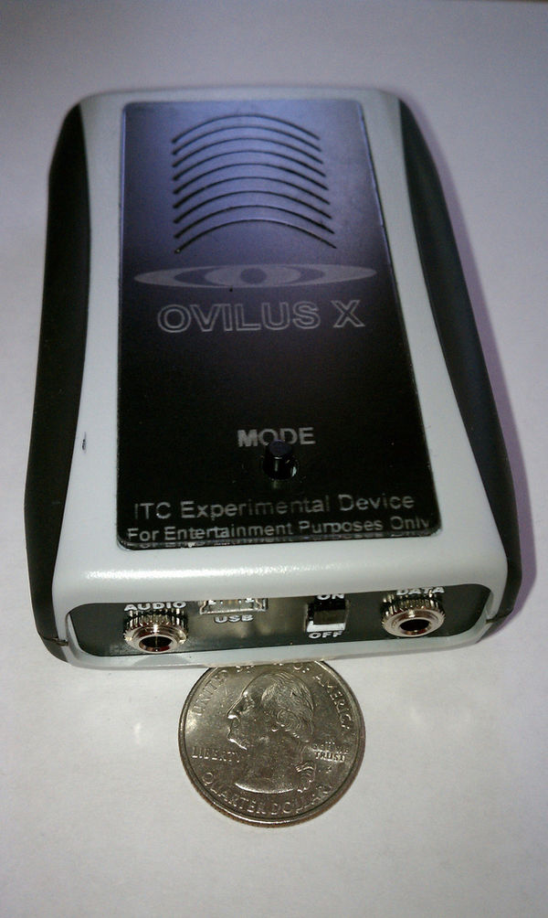 An Ovilus device, which plays recorded words from a pre-programmed dictionary in response to electromagnetic field variations. It is branded as "For E