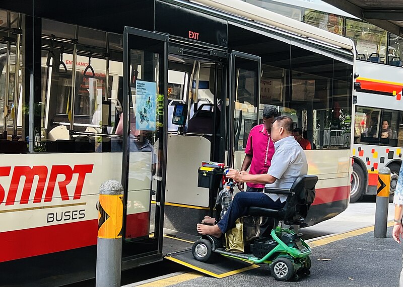 File:Person on PMD boarding an SMRT bus, August 2022.jpg