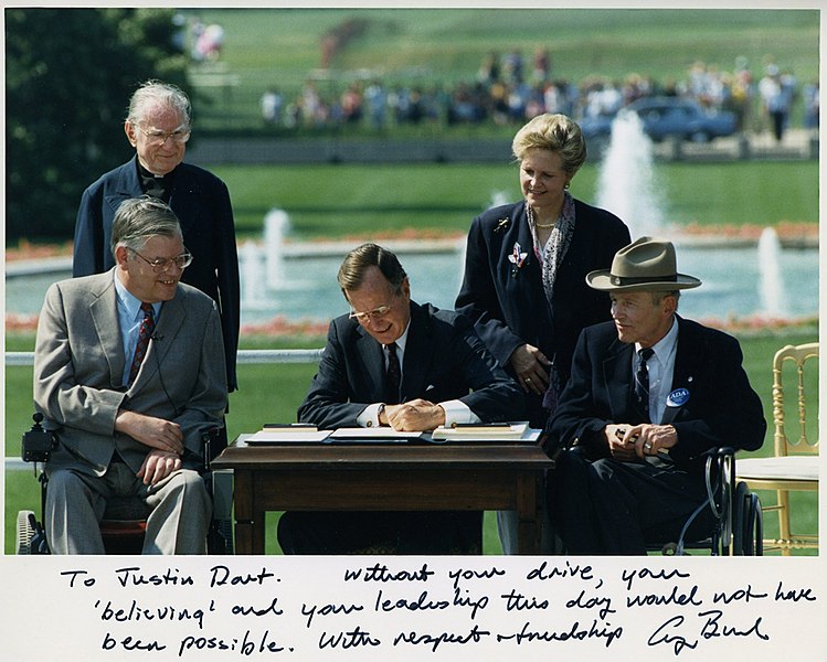 File:Photo of President George H. W. Bush signing the Americans with Disabilities Act inscribed to Justin Dart, Jr., 1990.jpg