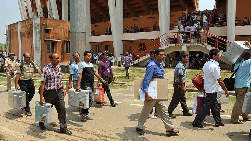 File:Polling officials carrying the Electronic Voting Machines (EVMs) and other necessary belongings for use in the General Assembly Elections, at Sarusaghai, Guwahati, in Assam on April 10, 2016.jpg