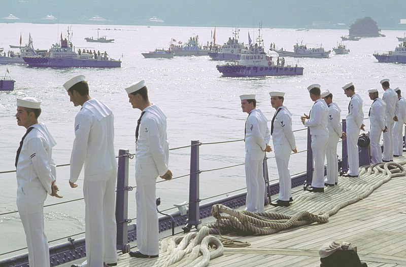 File:Sailors man the rail as the battleship USS NEW JERSEY (BB-62) as Japanese police boats surround the ship to screen out protesters - DPLA - 508c0b85b9ce72419de9c83a84bafda0.jpeg
