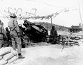 Personnel of No. 4 gun, Battery "B", 999th Armored Field Artillery Battalion, U.S. Eighth Army, fire on enemy positions, 23 Feb 1952.