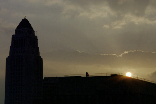 The silhouette of City Hall at sunrise.