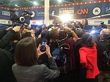 Spin room at the Las Vegas debate Spin room GOP debate CWT3YUtWEAEFTyI.jpg