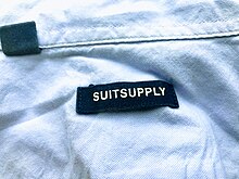 A brand label on the inside of a Suitsupply dress shirt Suitsupply shirt label.jpg