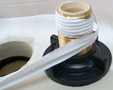 Teflon tape, being wrapped on a pipe thread.