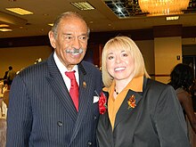 Trish Brown and Congressman John Conyers at the Western-Wayne NAACP Freedom Fund Dinner in 2012. Brown was awarded the "Great Expectations" award. Trish Brown and Congressman John Conyers.JPG