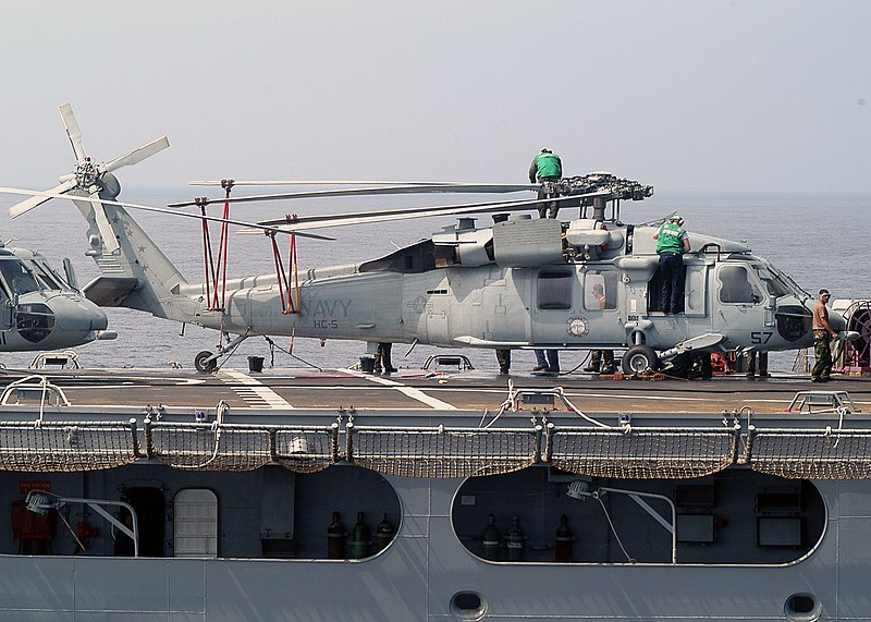 File:US Navy 030819-N-9860Y-013 Airmen from USNS Niagara Falls (T-AFS-3) are seen conducting maintenance on top of an SH-60S Seahawk during a recent underway replenishment with USS Blue Ridge (LCC 19).jpg