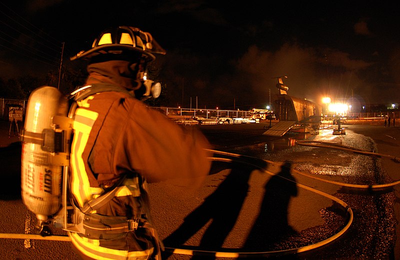 File:US Navy 070829-N-4965F-018 A federal firefighter assigned to Navy Region Hawaii Federal Fire Department waits to participate in an aircraft firefighting training evolution with the Mobile Aircraft Firefighting Training Device.jpg