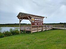 Viewing platform with sign visible from New York State Thruway Viewing platform with sign at Montezuma National Wildlife Refuge.jpg