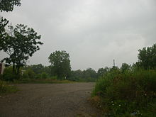 The station site of the 1884 depot, seen in August 2012 Warren Erie Railroad station (pre-1966).jpg