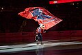 Waving a Capitals banner before the team faces the Penguins in 2020.