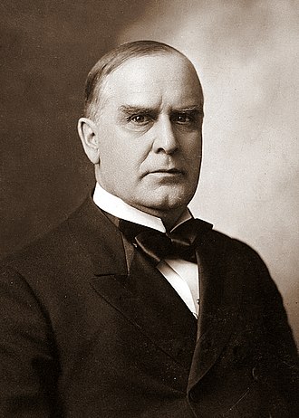 A headshot of McKinley in formal attire