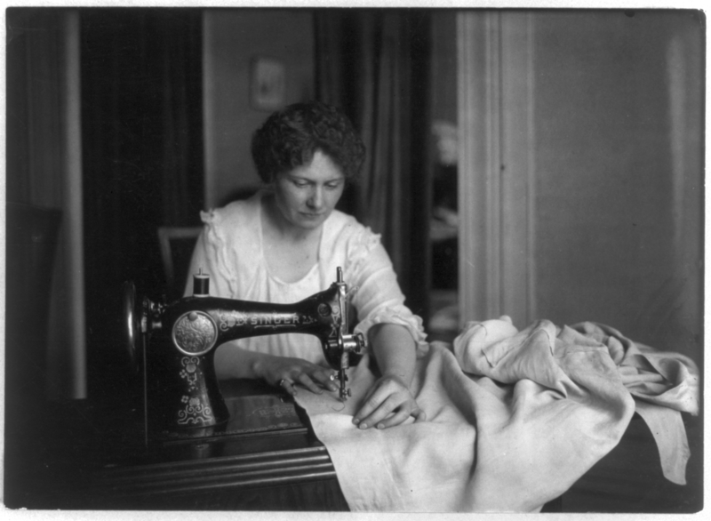 File:Woman sewing with a Singer sewing machine.png