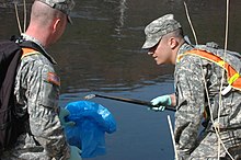 World Water Day 2009: US soldiers cleaning a river in South Korea World Water Day (3384841410).jpg