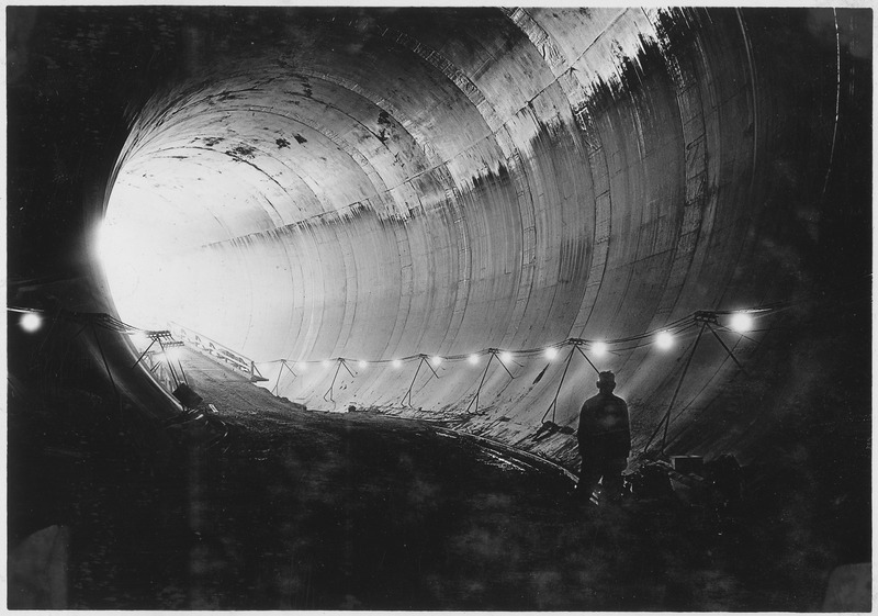 File:"Completed concrete tunnel lining near inlet portal of diversion tunnel No. 4. Coating of moisture reserving paint is... - NARA - 293692.tif