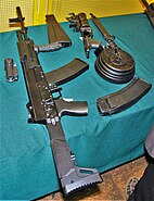 The early proposed prototype model of the AK-12 with various accessories.