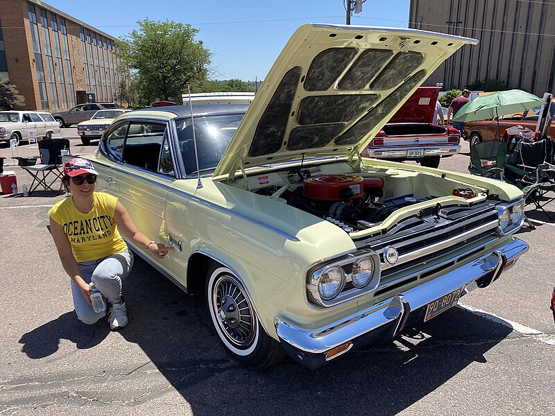 File:1966 AMC Marlin in Apollo Yellow and black vinyl with 327 automatic 2021 AMO show 01of14.jpg