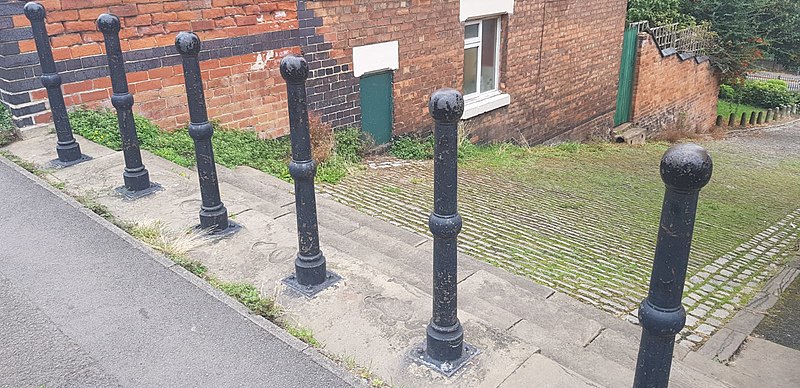 File:6 Bollards at Junction with Well St.jpg