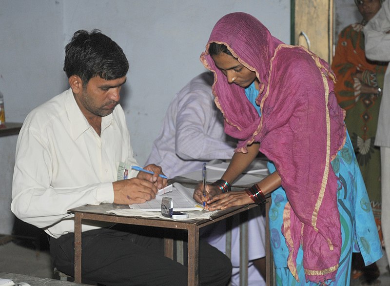 File:A woman voter registering her name to cast her vote, at a polling booth, during the 6th Phase of General Elections-2014, in Dausa, Rajasthan on April 24, 2014.jpg