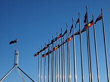Aboriginal, Torres Strait Islander and Australian flags outside the Australian Parliament House, 2016. Aboriginal, Torres Strait Islander and Australian flags outside the Australian Parliament House in July 2016.jpg