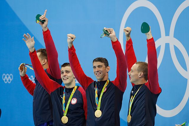 The American final team (Adrian, Held, Phelps, and Dressel), after winning the 4 × 100 m freestyle relay at the 2016 Olympics.