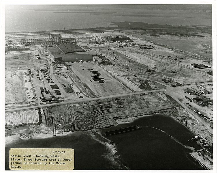 File:Aerial View - Looking West. Plate, Shape Storage Area in Foreground Delineated by the Crane Rails. 2-12-69 (17378712311).jpg