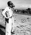 Americal Division commander, Major General Alexander M. Patch, Jr., watches while his troops and supplies are staged on Guadalcanal's beaches on 8 December 1942, the day before he relieved General Alexander A. Vandegrift and his wornout 1st Marine Division.