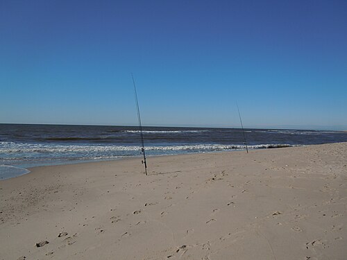 Sylt, Germany: Fishing rods at a beach