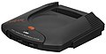 The front of the Atari Jaguar features heavy branding, as well as two front controller ports slightly obscured by a rim.