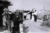 A wedding ceremony held in a tent camp of IDPs in Tartar (by Ilgar Jafarov, 1996) Azerbaijani refugees from Karabakh 14.jpg