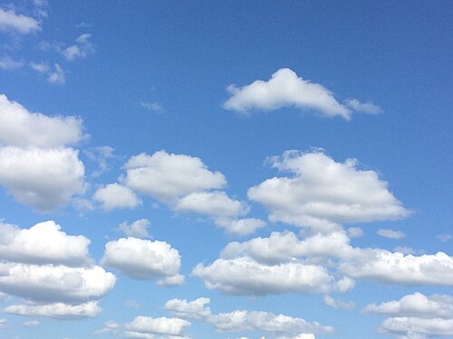 blue skies with cumulus clouds