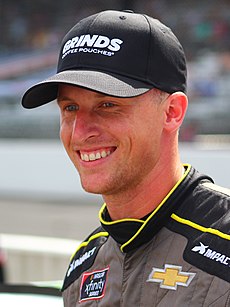 A smiling Brown in his racing uniform