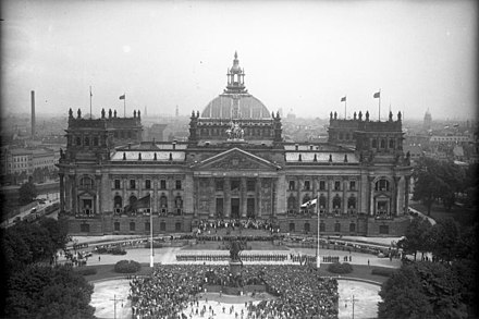 The masses gather, in 1932, to celebrate the Weimar constitution. The square in front of the Reichstag, then and now again, has the name Platz der Republik.