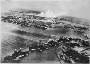 Captured Japanese photograph taken during the attack on Pearl Harbor, Dec. 7, 1941. In the distance, the smoke rises... - NARA - 520600.tif