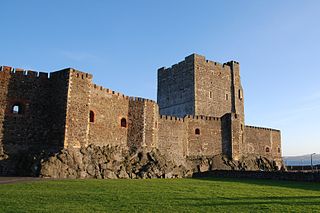 Carrickfergus Castle is a 12th-century Norman castle in on the shore of Belfast Lough. Besieged by Scots, Irish, English and French, the castle has long played an important military role in the history of Ireland
