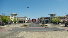 a road entrance to Cascade Station facing Sports Authority