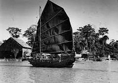 Image 140A Chinese junk in the Kinabatangan District of northern Borneo, photographed by Martin Johnson c. 1935 (from Malaysian Chinese)